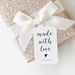 May include: A white gift tag with black text that reads "made with love" and a small black heart. The text "BY MICHELLE" is printed below the heart.
