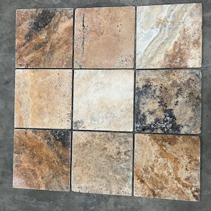 May include: Nine square tiles with a travertine finish. The tiles have a beige, brown, and gray color scheme with a natural stone look.