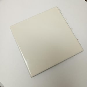 May include: A square, off-white ceramic tile with a smooth, glossy finish. The tile features clean, straight edges and a uniform, solid color surface. It is positioned at an angle, showcasing its flat, reflective top and simple, unadorned design.
