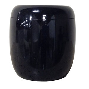 May include: A black, round, ceramic planter with a glossy finish.
