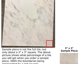 May include: A close-up of a white marble tile sample. The sample is a 3" x 3" square and is outlined in red. The full tile is not shown in the image.