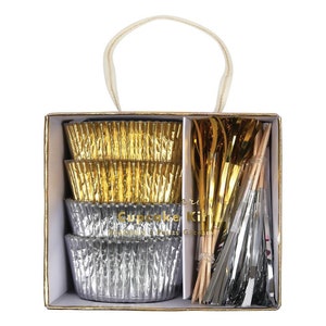 May include: A cupcake kit containing gold and silver cupcake cases, gold and silver streamers, and wooden skewers. The kit is packaged in a box with a handle.