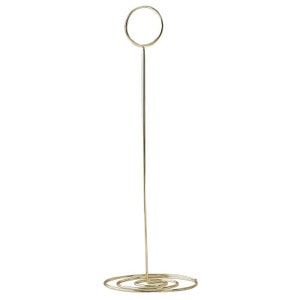 May include: A gold metal picture frame stand with a round top and a spiral base.