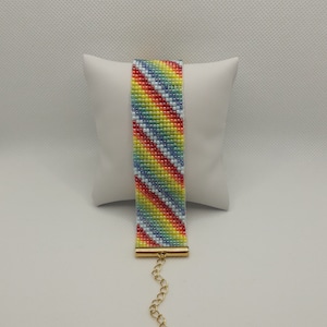 Multicolor wide beaded bracelet with adjustable lenght. Made with Toho beads 11/0.