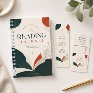 May include: A spiral-bound reading journal with a cream-colored cover featuring the words "Reading Journal" and decorative leaf and geometric designs in dark green and rust. Two matching bookmarks are also included.