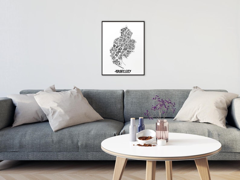May include: Black and white typography art print of Jersey City, New Jersey. The print features the names of neighborhoods and landmarks within the city's outline.