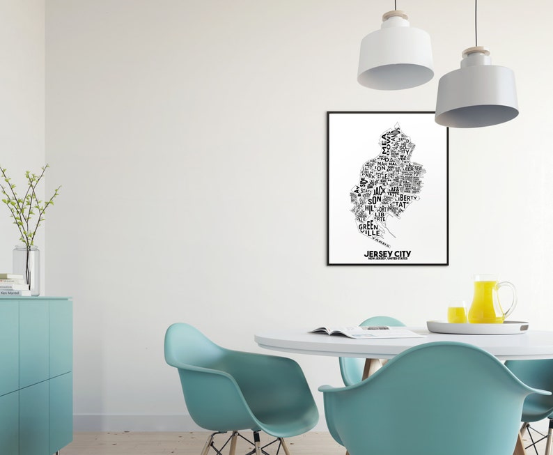 May include: A black and white typography art print of Jersey City, New Jersey. The print features the names of neighborhoods and landmarks within the city, forming the shape of the city.