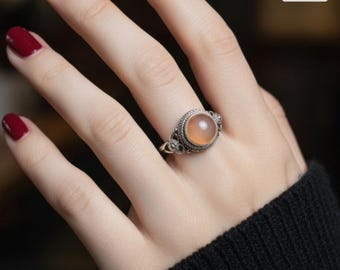 Sterling silver ring with a peach moonstone gemstone