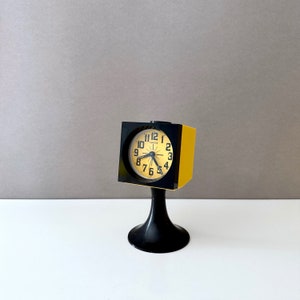 Yellow Space Age alarm clock with tulip base from Europa, table clock with alarm, 70s