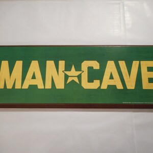 Man Cave Green and Yellow Sign