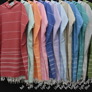 May include: A row of ten hooded towels in various colors, including red, mint, orange, light pink, sax blue, lilac, baby blue, beige, turquoise, mint green, light green, and olive.