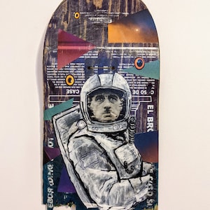 Space Smoke - mixed media collage on a broken skateboard