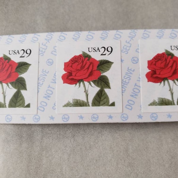 Vintage strip of red rose 29 cent postage stamps