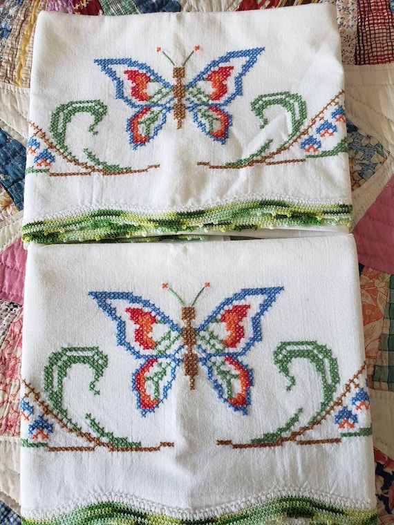 Beautiful pair of vintage cross stitched butterfly pillowcases