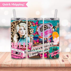 May include: Three stainless steel tumblers with colorful designs featuring a portrait of Dolly Parton, butterflies, rhinestones, and the text "II Dolly We Trust" and "what would Dolly do".