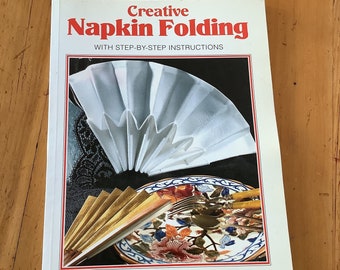 Creative napkin folding, step-by-step instructions, by Didier Boursin, Paris boutique, artist in paper folding