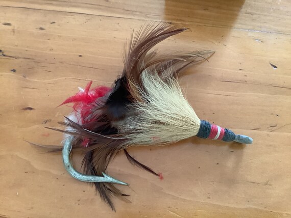 feathers for fishing lures Clam Gaff Feathered Treble Hooks #10 / Pink Each lure comes rigged with 6 feet of 100# monofilament and a 7/0 Mustad 3407 hook 6" Rigged Tuna Feathers Red/White