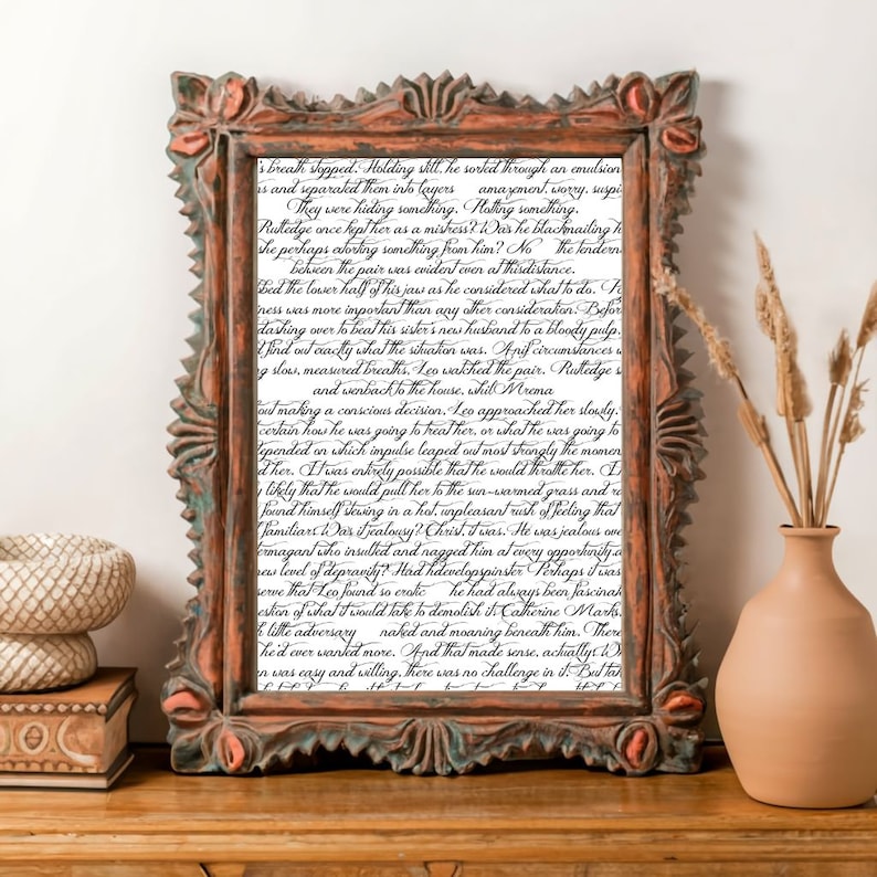 May include: A close-up of a framed piece of art with a handwritten text in black ink. The text is a story about a man named Leo and his relationship with a woman named Catherine. The text is written in a flowing, cursive script.