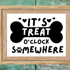 May include: A framed print with a black bone shape and the text "It's Treat O'Clock Somewhere" with paw prints and hearts.