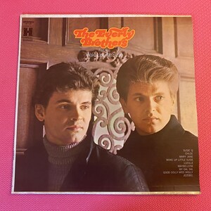 May include: A vintage vinyl record album cover featuring a photo of The Everly Brothers. The album title is "Wake Up Little Susie" and the album cover is in shades of brown and white.
