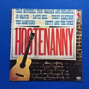 May include: Vintage vinyl record album cover for "Hootenanny" featuring a guitar and brick wall design. The album includes artists like Chad Mitchell Trio, Jo March, and The Samplers. The cover has a retro aesthetic with bold typography.
