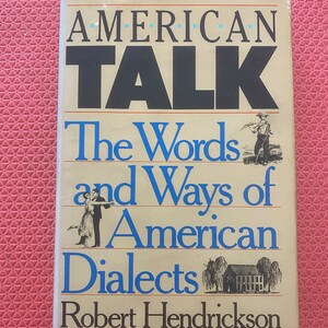 May include: A book titled "American Talk: The Words and Ways of American Dialects" by Robert Hendrickson. The cover features illustrations of people in various settings.