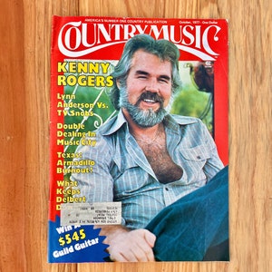 May include: A vintage Country Music magazine cover featuring Kenny Rogers with a headline that reads "Kenny Rogers". The cover also includes text that reads "America's Number One Country Publication" and "October, 1977 - One Dollar".