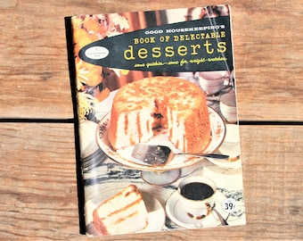May include: A vintage cookbook titled "Good Housekeeping's Book of Delectable Desserts" with a photo of a cake on the cover. The text on the cover reads "some quickies - some for weight-watchers".
