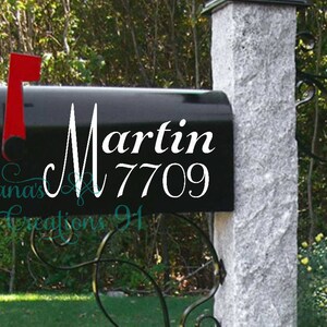 May include: Black mailbox with a white vinyl decal that says "Martin 7709".