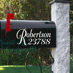 May include: Black mailbox with a white vinyl decal that says "Robertson 23788".