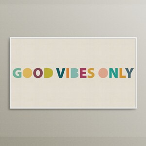 May include: A white framed print with the text "GOOD VIBES ONLY" in colorful letters. The letters are in different colors, including green, yellow, red, purple, blue, orange, and pink.