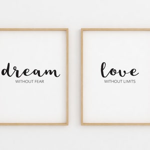 May include: Two framed prints with inspirational quotes. The left print says "dream without fear" and the right print says "love without limits".