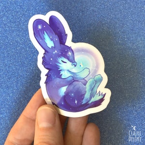 Glittersticker van hemels konijntje met een ster || originele ruimtekonijnsticker