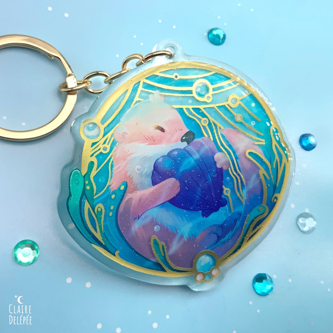 Cute Otter Keychain an Otter Holding a Seashell in a Golden Etsy