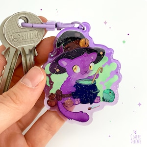 Cute witch and its frog familiar making a potion keychain , an acrylic charm of a cute kitten- kawaii acrylic accessory