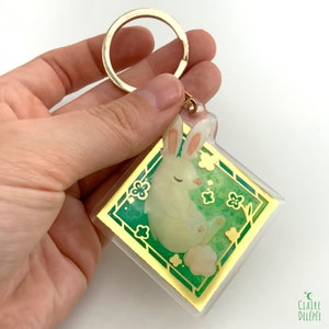 Cute Rabbit Keychain : a Sleeping Bunny in a Gold Frame, With Clovers ...
