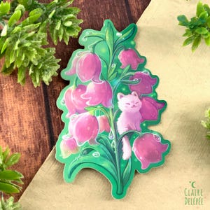 Sticker de petit chat assis sur une fleu  - autocollant mignon inspiré par la nature et les plantes