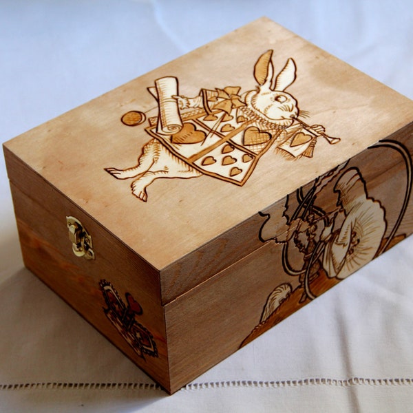 Wooden box carved with Alice in wonderland patterns