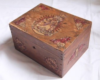 Wooden box carved with Santa Muerte patterns