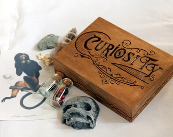 Engraved wooden box containing curiosities