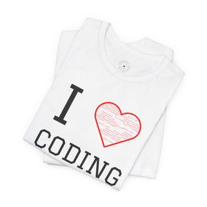 May include: White t-shirt with the text "I love coding" in black. The word "love" is replaced with a red heart filled with code.