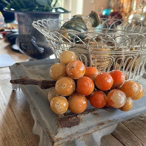 Old large bunch of grapes, albast, warm colored