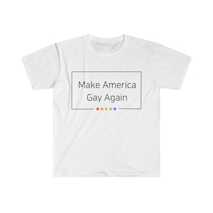 May include: White t-shirt with the text "Make America Gay Again" in a black box. Five rainbow stars are below the text.
