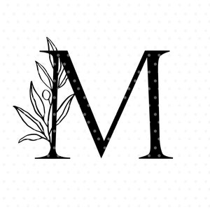 May include: Black and white illustration of the letter M with a floral design on the left side. The text "ANGÉLE KAMP" is at the bottom of the image.
