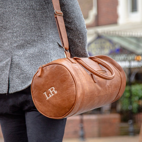 Faux Leather Barrel Bag With Personalised Luggage Tag By Duncan