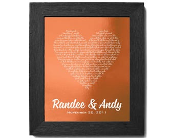 May include: A copper-colored framed print with a heart-shaped design. The heart is filled with white text that reads "Take your bags, we'll all go when you need to go. When we're together, we could do anything, baby." The text below the heart reads "Randee & Andy, November 20, 2011".