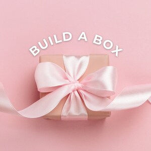 build a box Kraft wrapped in pink sating ribbon