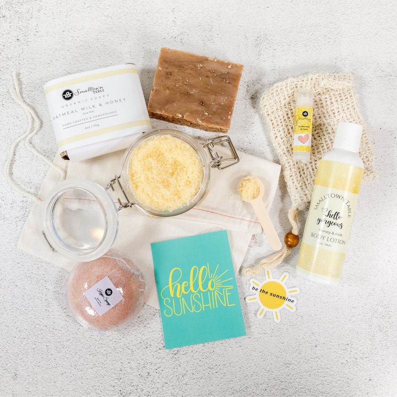 Top View of self care gift box and a hello sunshine card. Taken out of the box