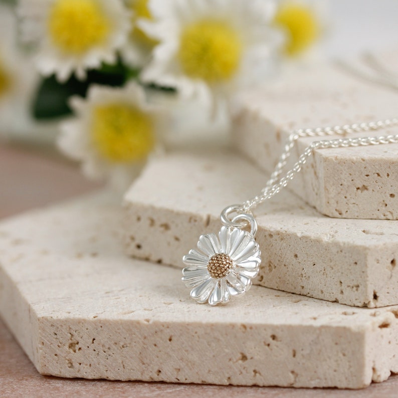 solid sterling silver daisy pendant with solid gold middle