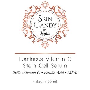 May include: A product label for "Skin Candy by Laurie" features a circular logo with ornate copper-colored flourishes. The label reads "Luminous Vitamin C Stem Cell Serum" with ingredient details and a 1 fl. oz. / 30 ml volume.
